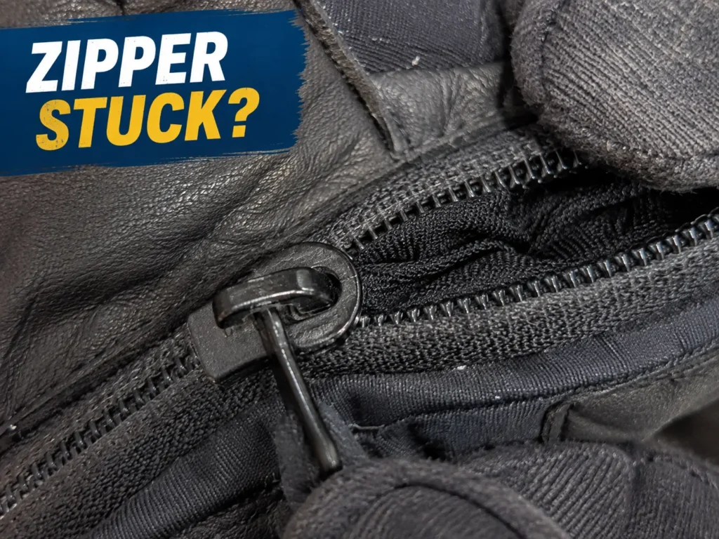 Ski glove zipper stuck — fabric caught in the slider teeth