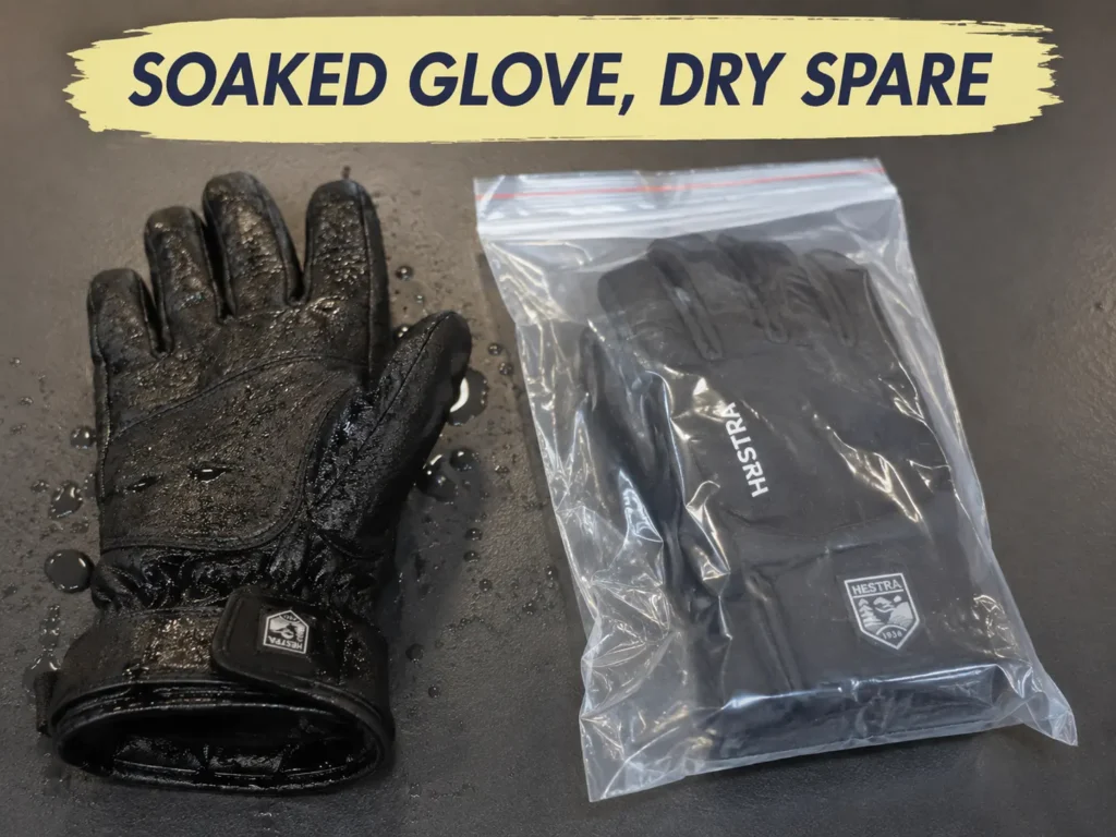 Soaked glove next to a dry spare pair