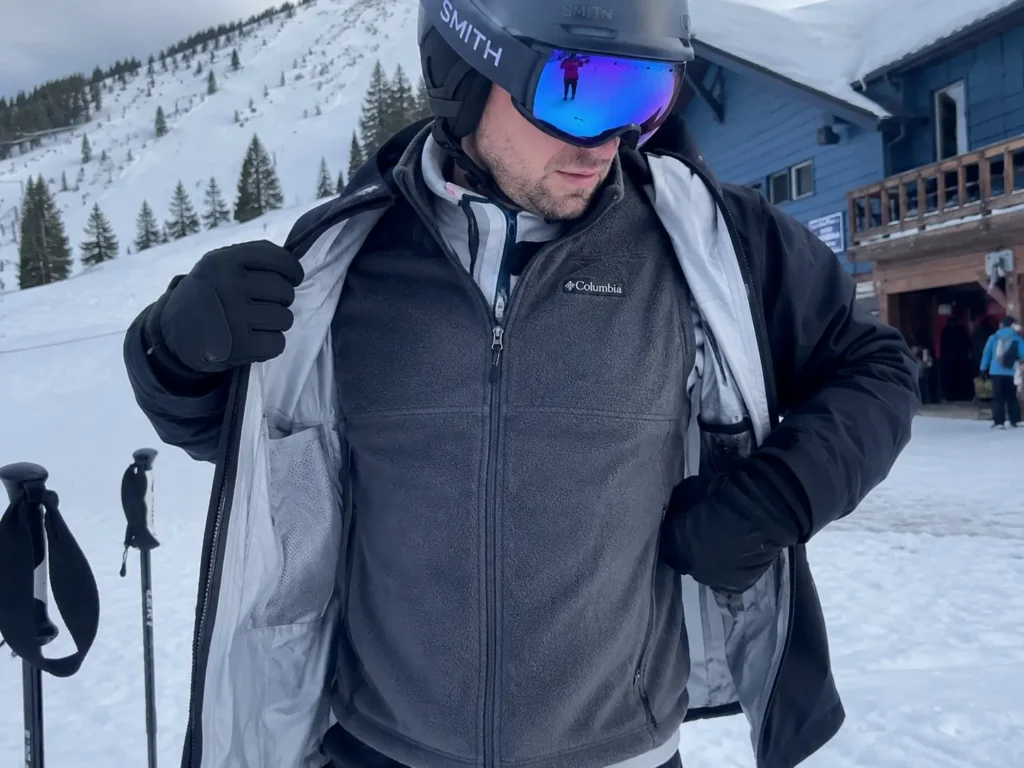 Adding a mid-layer vest to boost core temperature and keep hands warm