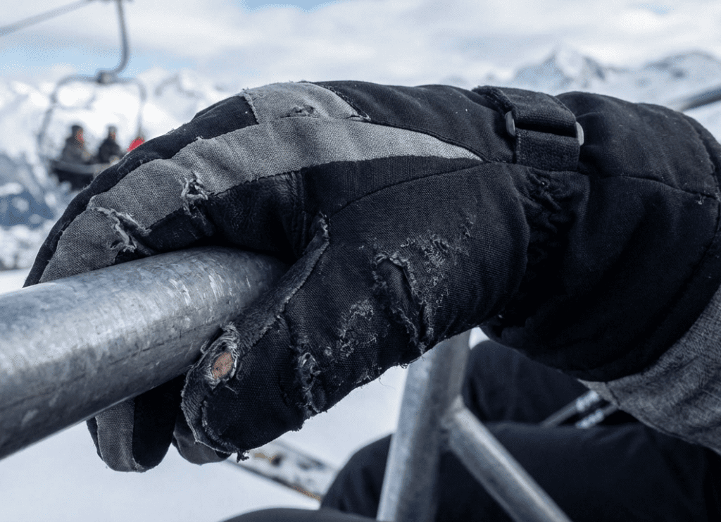 why ski gloves get damaged on chairlifts from metal bar friction