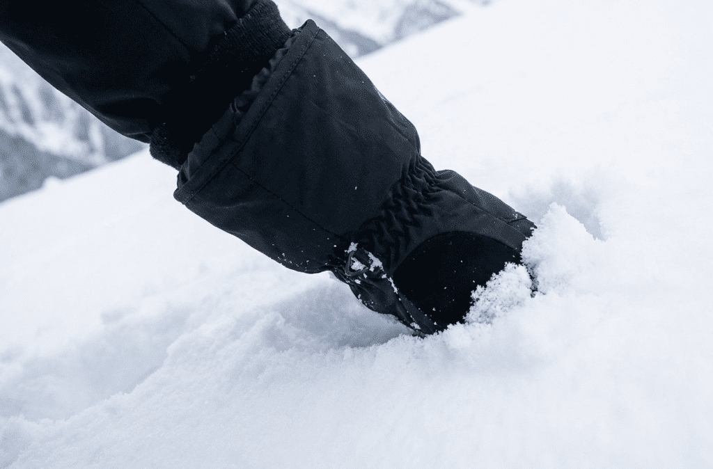 ski gloves with snow gaiters blocking snow entry