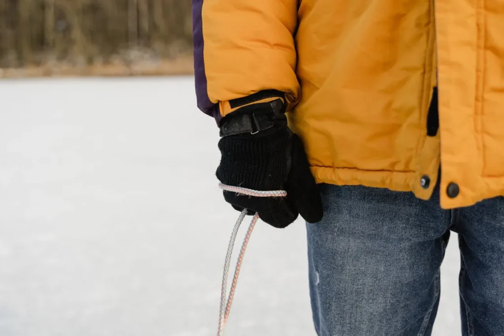 Skier warming cold hands during a break