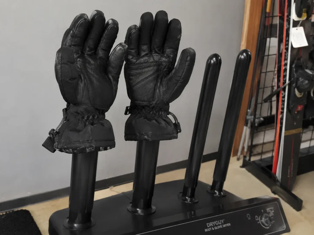 Gloves drying on a boot dryer rack