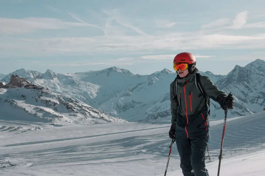 Skier on a high, exposed mountain ridge