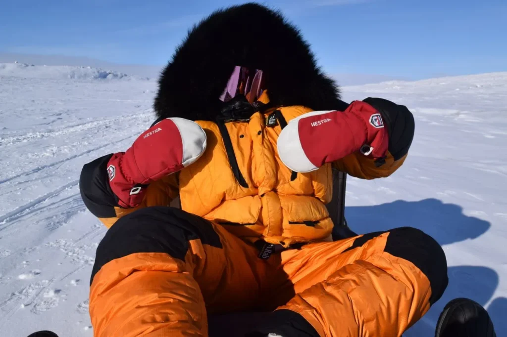 Mountaineer wearing gloves in extreme cold