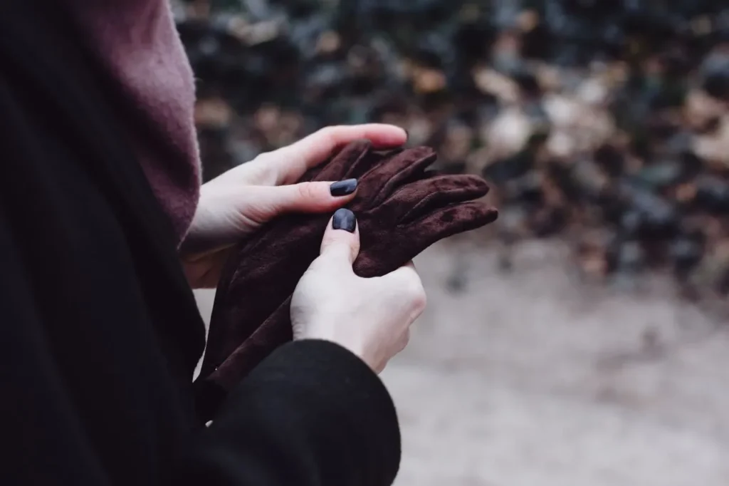 Close-up of hands wearing winter glove liners