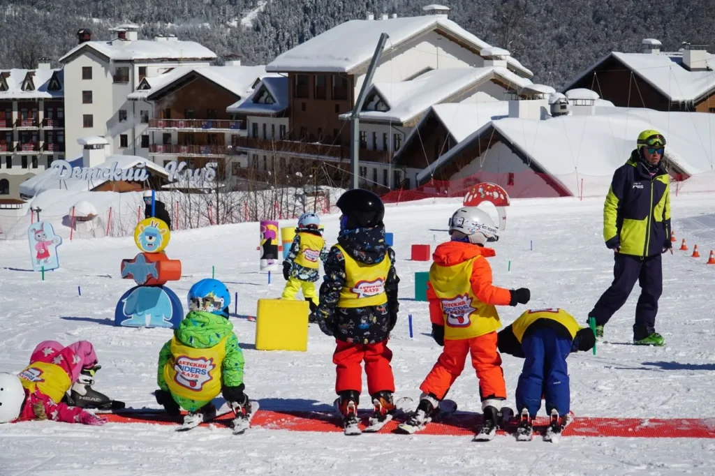 Young skier in a lesson wearing insulated gloves