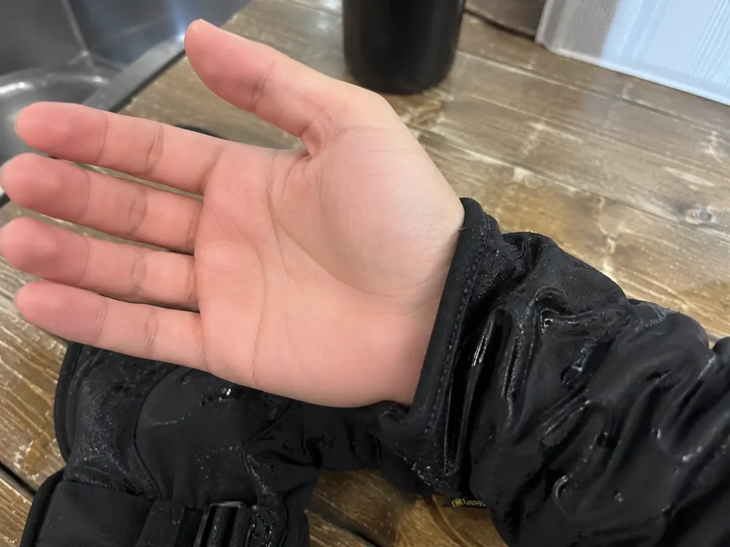 Proving a dry hand after testing the best waterproof ski gloves in wet conditions