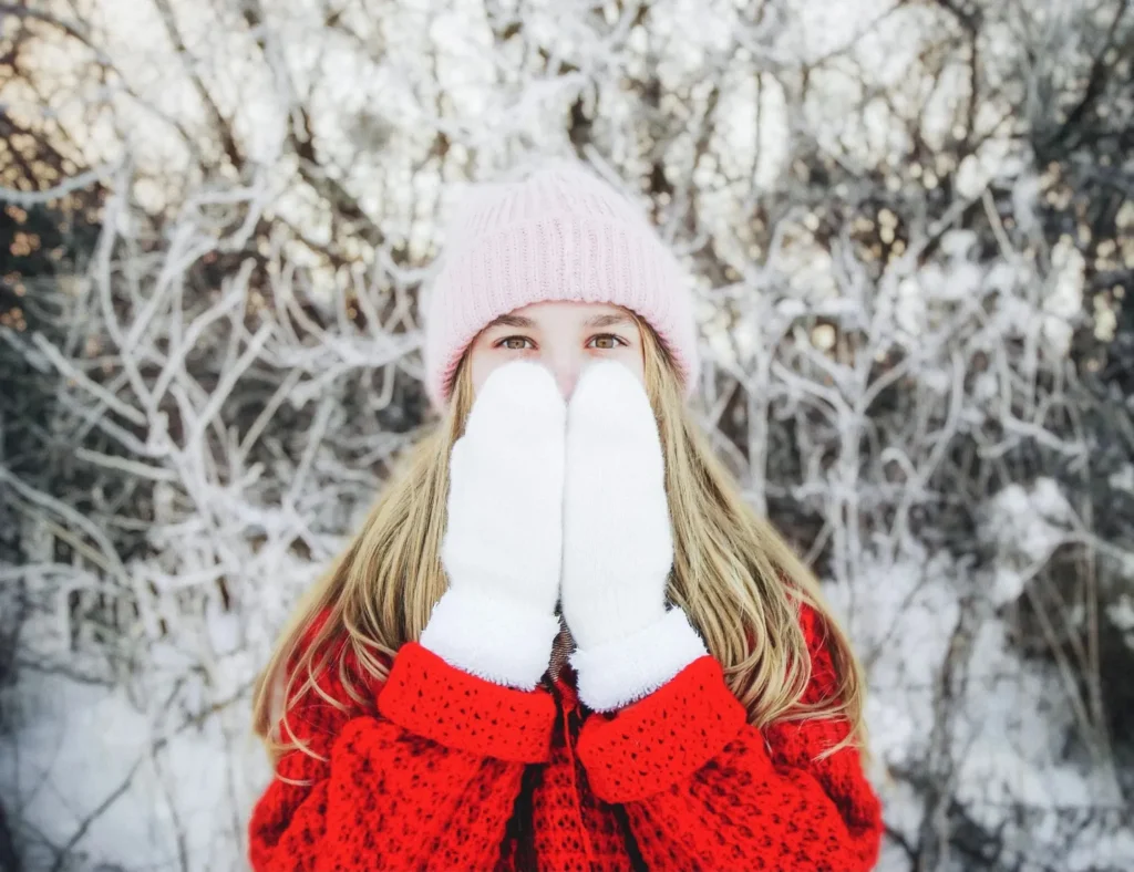 Skier wearing warm mittens in extreme cold conditions