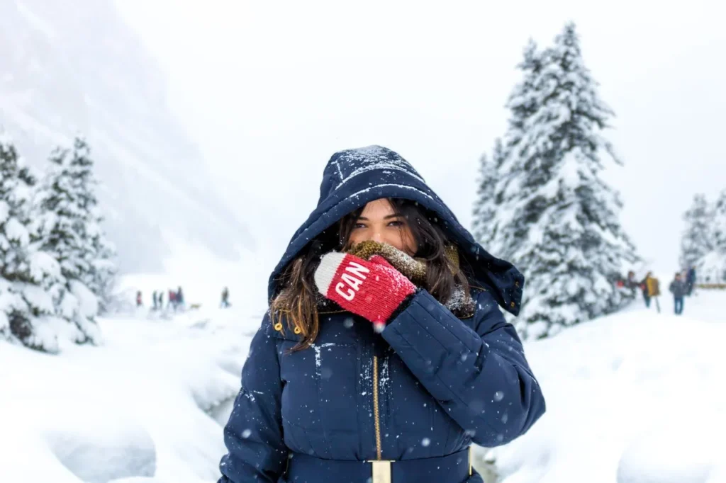 Insulated winter glove in extreme cold, snow-covered conditions